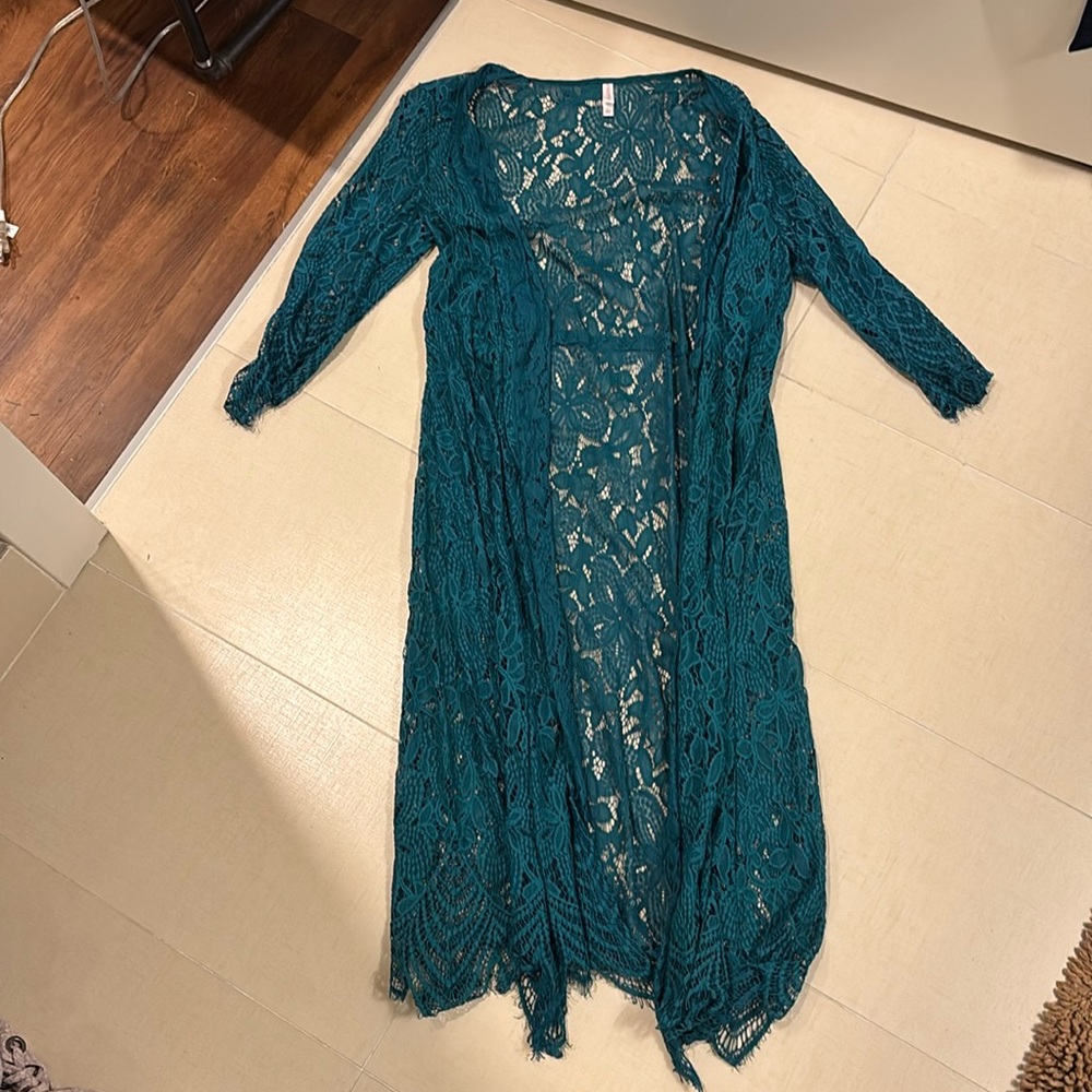Turquoise swim suit cover up. Or could be worn as cardigan.